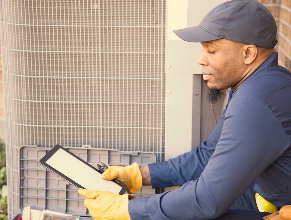 Air Conditioner Repairman at work | US DOL | A James Global